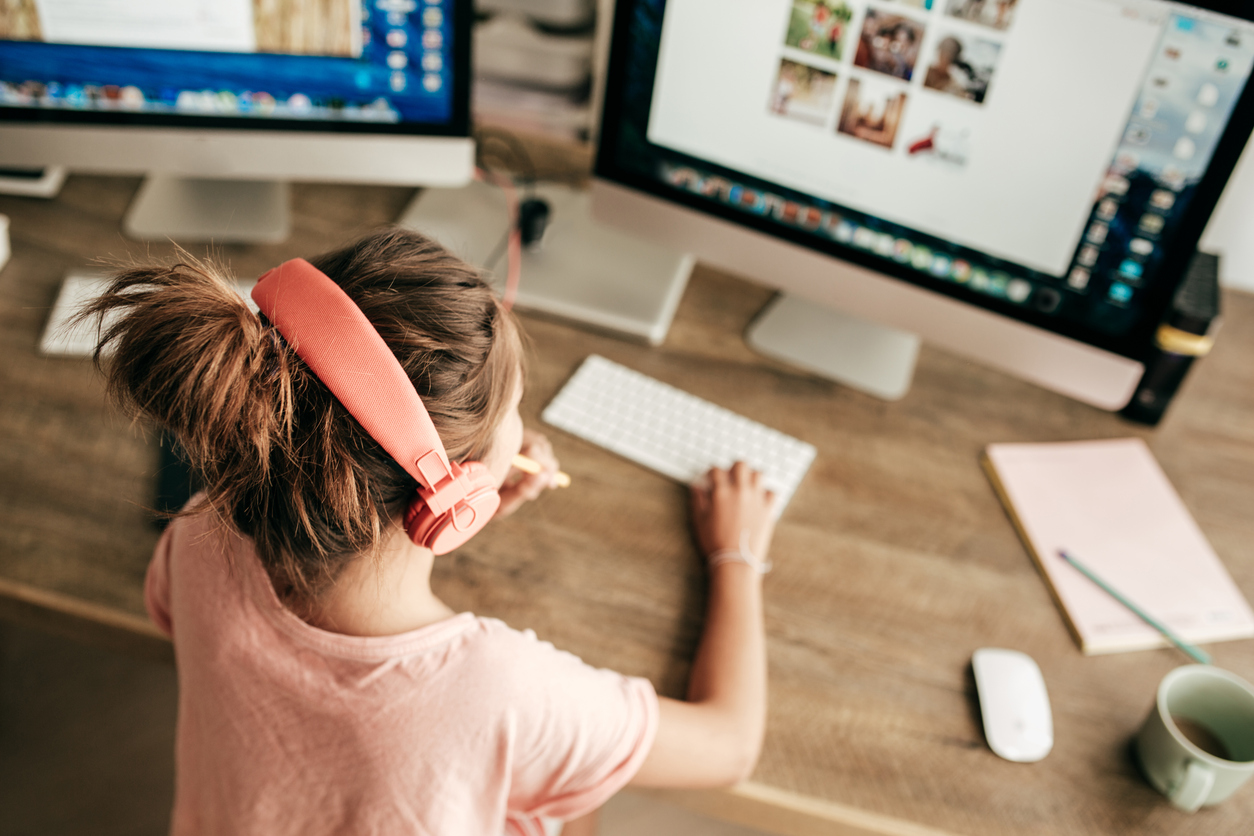Girl learning on computer, showing technology making a difference